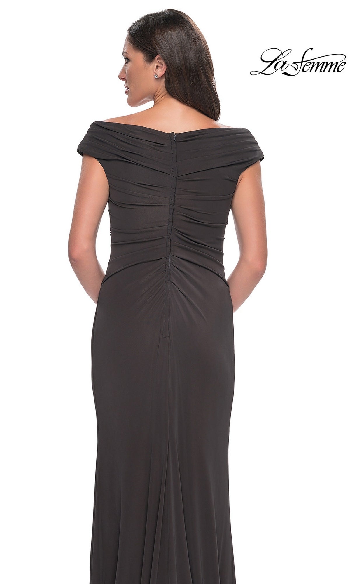 Woman wearing La Femme 30040 long formal dress with off-the-shoulder V-neckline, gathered jersey fabric, cap sleeves, and zip detail. “La Femme” logo in top right corner.